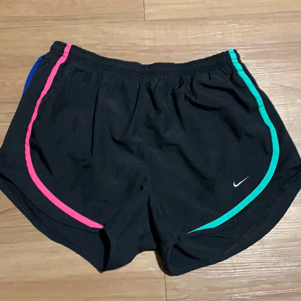 Women’s Nike dri fit shorts. Size medium. Black with multicolor stitching.